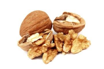 pieces of walnuts on white background