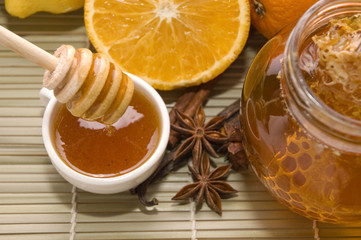 fresh honey with honeycomb, spices and fruits © joanna wnuk