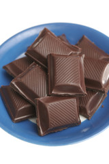 It is a lot of segments of chocolate lay on a plate