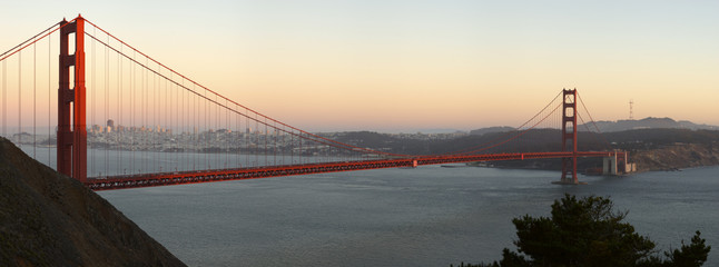 Golden Gate Bridge lit by sunset