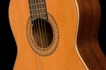 Obraz premium Classical guitar close up on dark background