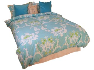 A Double Bed with a Colourful Quilt Cover.