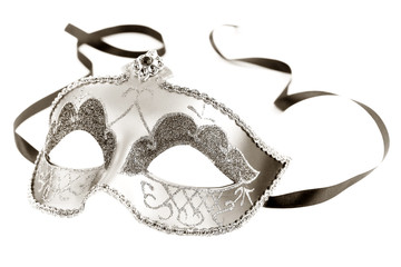 Sepia toned carnival mask on white background
