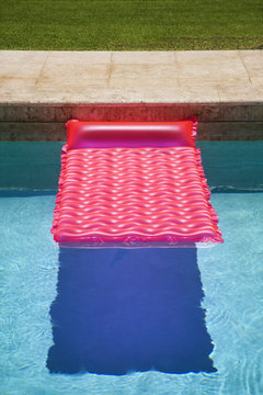 Pink float in  pool.