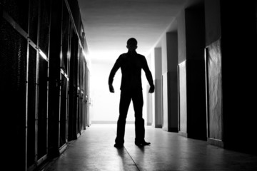 Man in the dark corridor