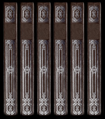 Old vintage leather book spines with silver decorative details
