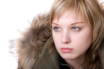serious girl in a jacket with a collar of fur