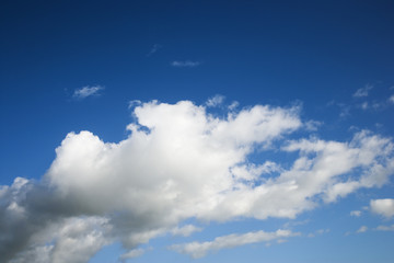 Naklejka na ściany i meble Cumulus cloud formation in blue sky.