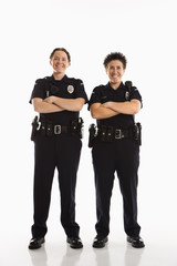 Policewomen crossing arms.