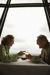 Photo sur Aluminium brossé Restaurant Mature couple at restaurant drinking wine and talking.