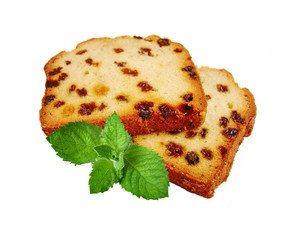 Two pieces of fruitcake and green mint isolated on white backgro