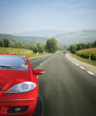 Red car on the road