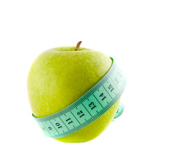 Apple with a measuring tape. Isolation on white