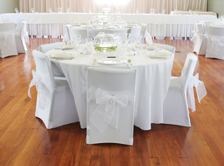 Tables decorated at a wedding reception.
