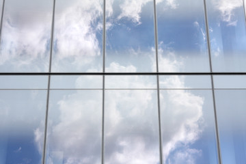 cloud reflections on glass office building