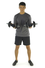 Fototapeta na wymiar Young man exercising arms muscles with dumbbells