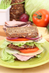 big sandwich and everything you need to have delicious breakfast