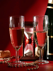 Happy New Year - sandglass and champagne