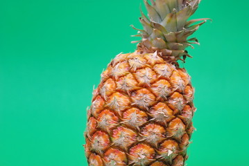 ananas on green background