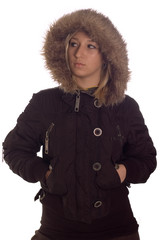 Fashion shot a young girl in winter jacket with hood