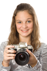 Fototapeta premium Young girl with SLR camera. Isolate oin white.