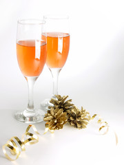 two glasses with wine and cones  wtih yellow ribbon with shadows
