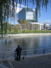 Futuristic landscape with fisherman