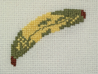 Detail of napkin embroidery (yellow banana), close-up