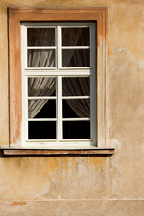 Window with drapes on old house in Prague, Czech Republic