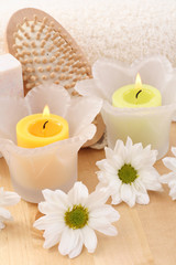 Obraz na płótnie Canvas beauty treatment - towel candles and flower