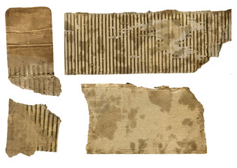 four pieces of rusted cardboard isolated on white background
