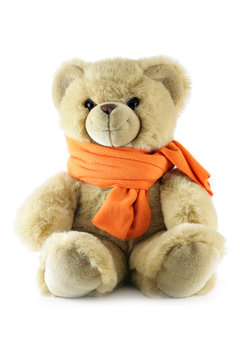 Teddy bear with scarf isolated over a white background