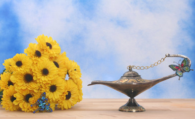 Antique Oil Lamp and Yellow Flowers 