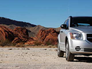Fototapeta na wymiar Silver car in the desert