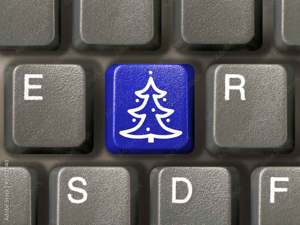 Wall mural Computer keyboard, key with christmas tree, close-up