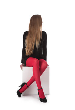 The girl in red stockings on a white background