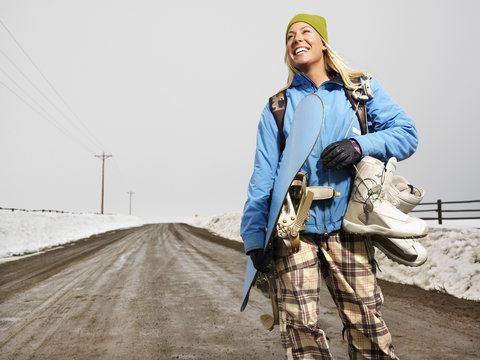 Woman Going Snowboarding.