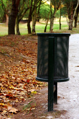 disposal garbage basket at the park in the fall