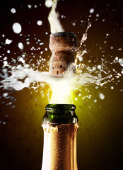 Close up of champagne cork popping