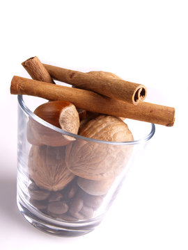 Cinnamon, walnut and nut in the white background