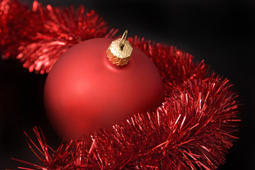 Christmas baubles, bows and garland on background