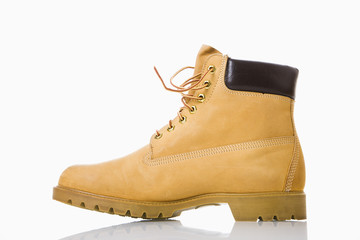 One tan work boot. - Powered by Adobe