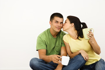 Naklejka premium Woman kissing man.
