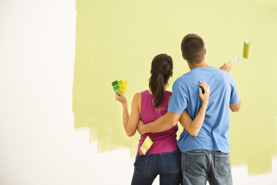 Couple Painting Home.