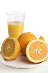 A glass of orange juice oranges 