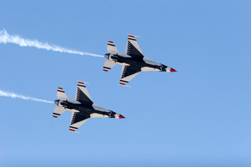 F-16 Thunderbird jets leaving smoke trails