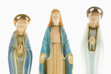 Virgin Mary statue with angelic figures on each side.