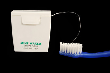 Dental floss and toothbrush