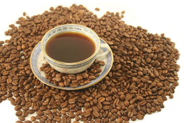Cup of coffee with beans  on a white background.