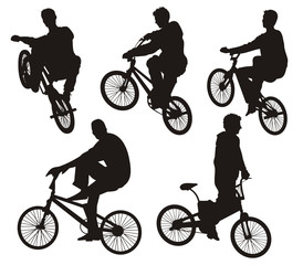 Five bicycle riders silhouettes